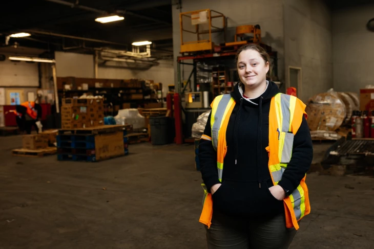 A Northern Air Cargo employee standing in the warehouse.