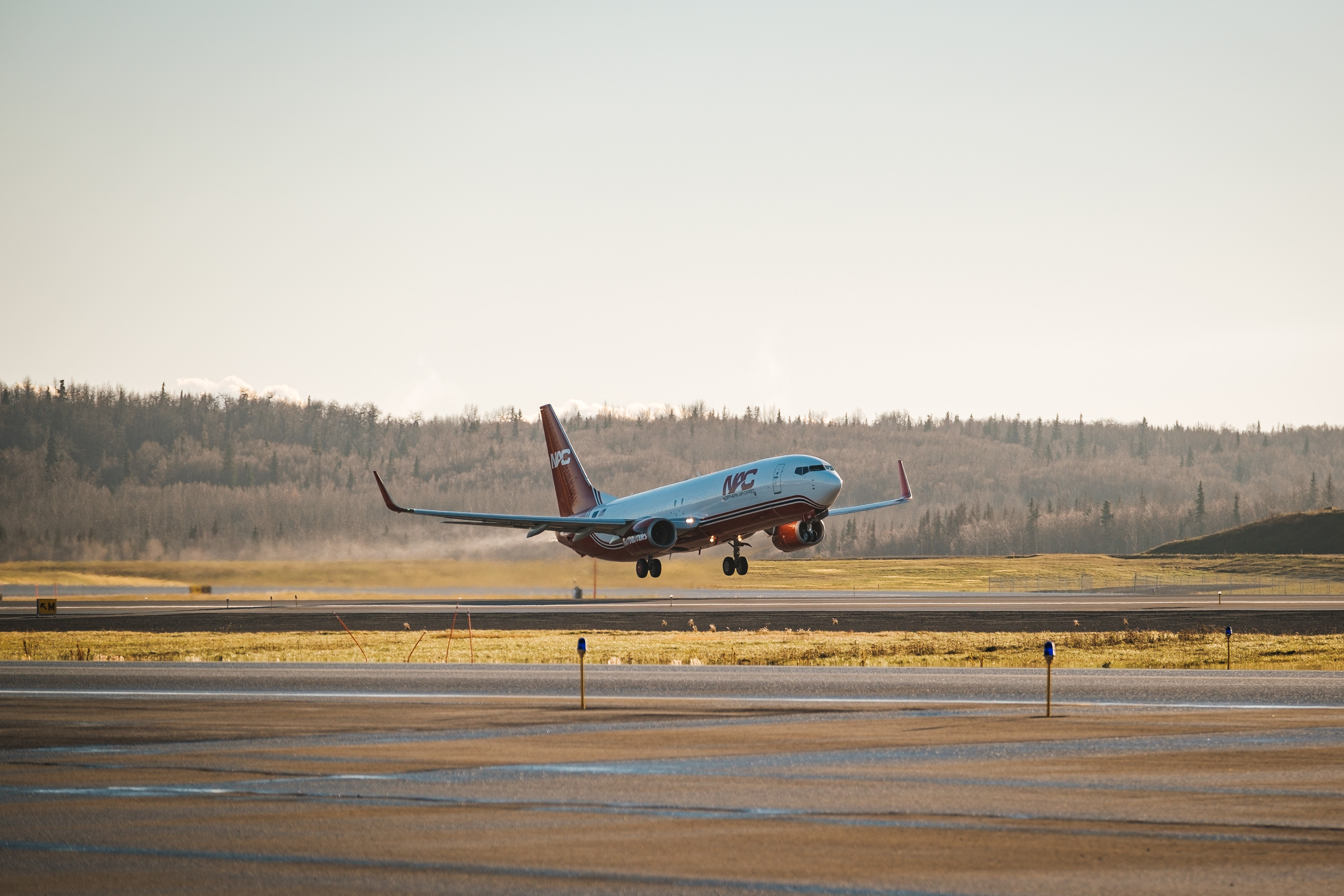 A Northern Air Cargo plane taking off on the runway.