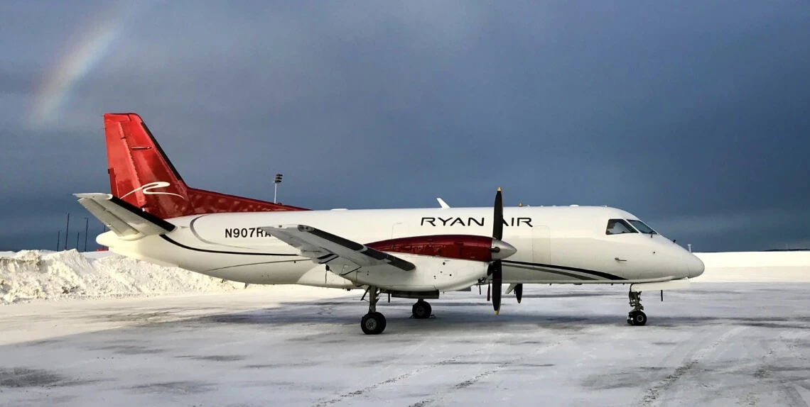 Photo of a SAAB-340 plane on a snowy runway in Alaska