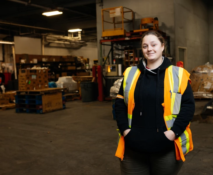 A Northern Air Cargo employee standing in the warehouse.