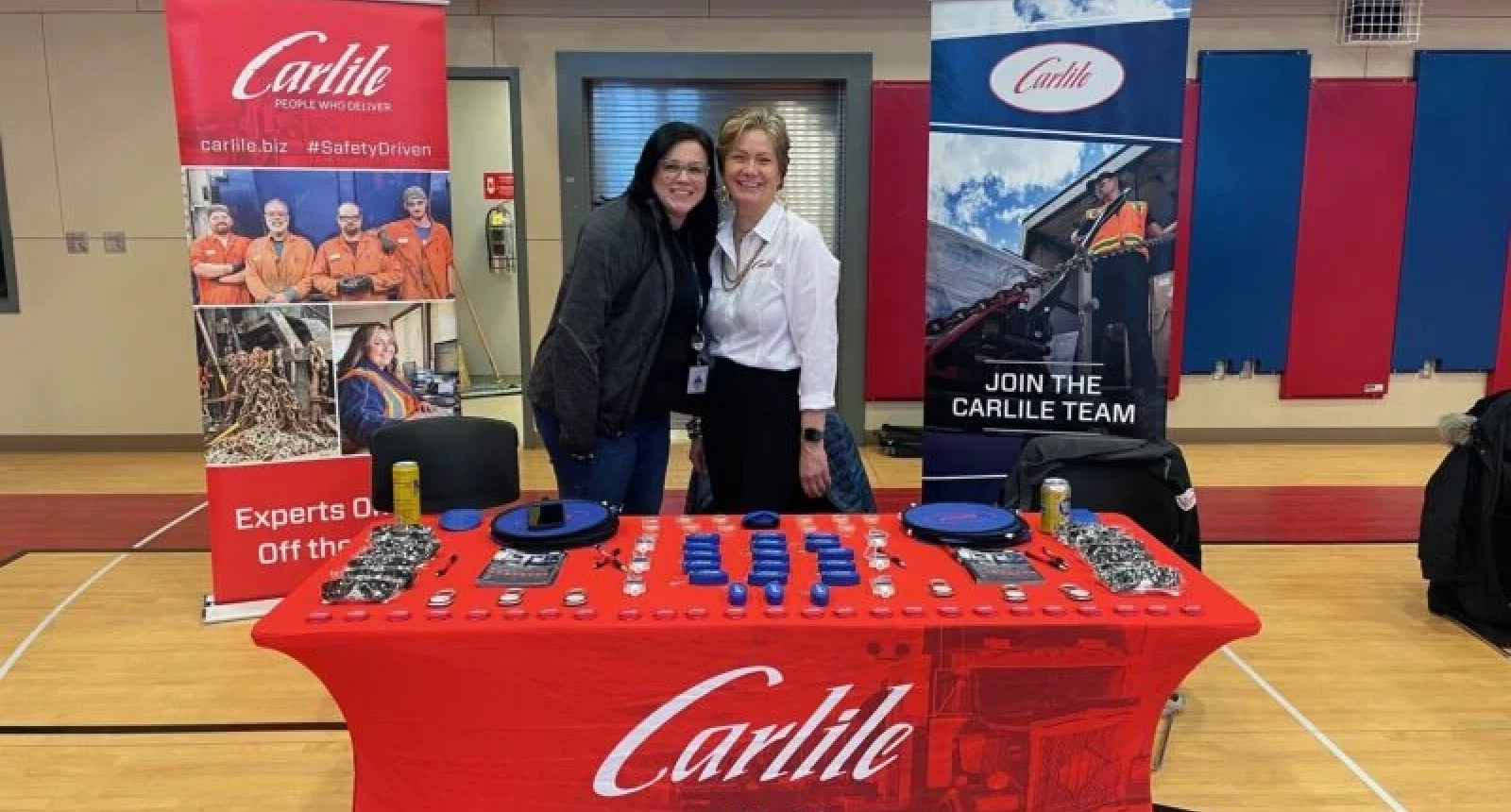 Photo of two Carlile employees at a job fair.