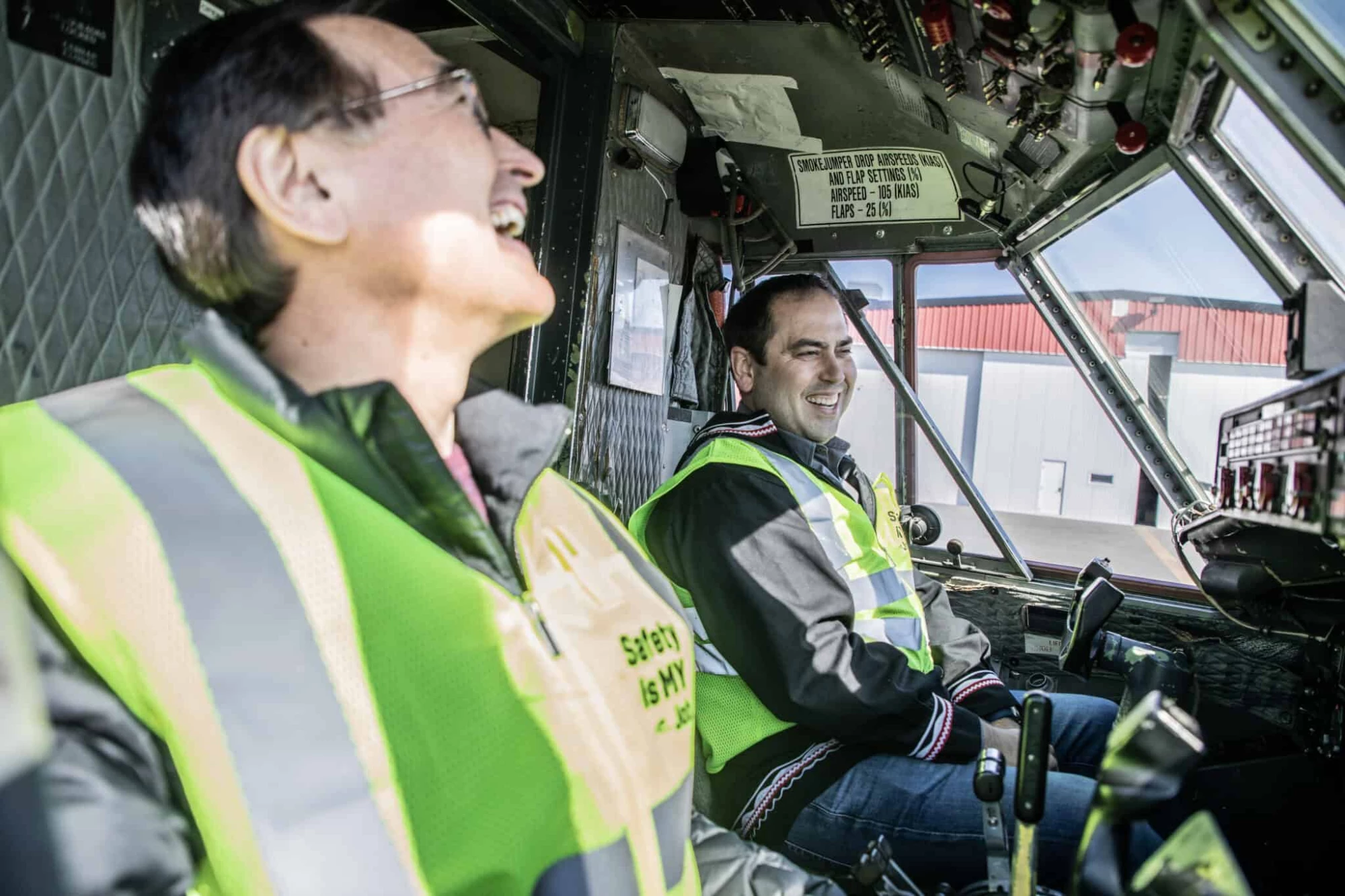 Photo of Lee and Wilfred Ryan sitting in the cockpit of a Ryan Air plane.