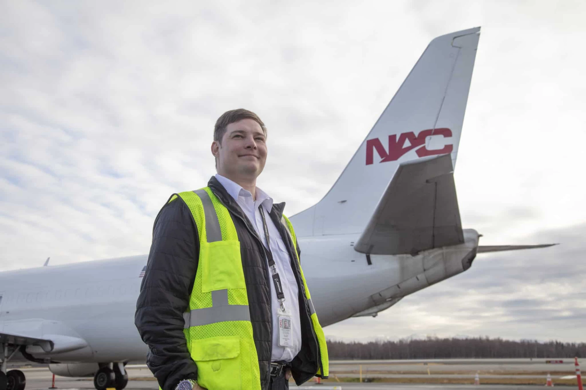 Northern Air Cargo pilot standing in front of a plane.