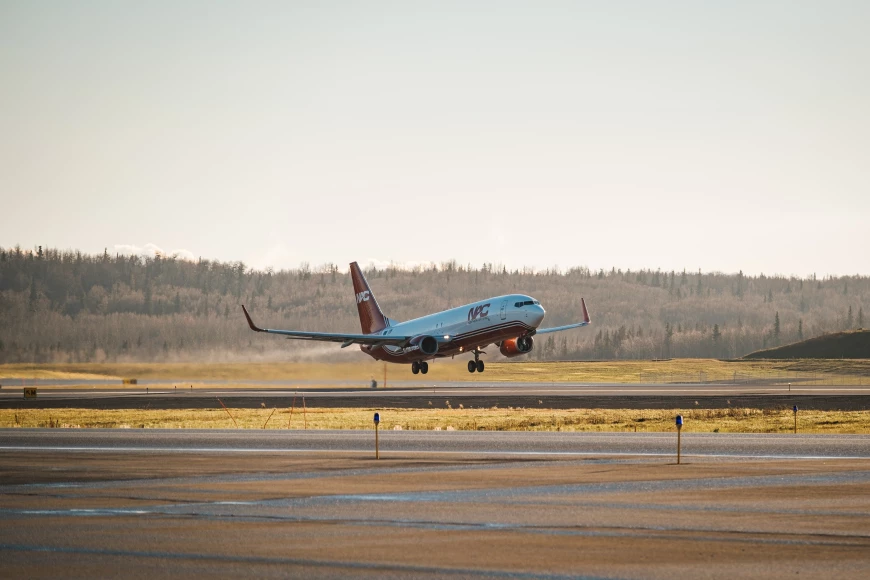 A Northern Air Cargo plane taking off on the runway.