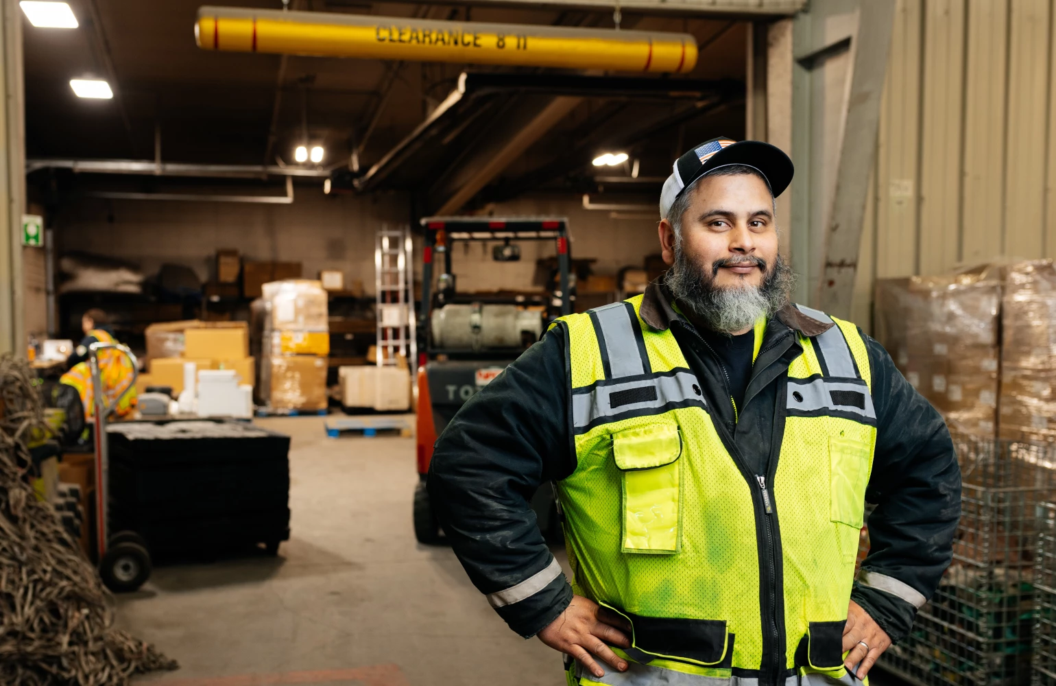 NAC employee standing in front of the Dangerous Goods Department of the warehouse.