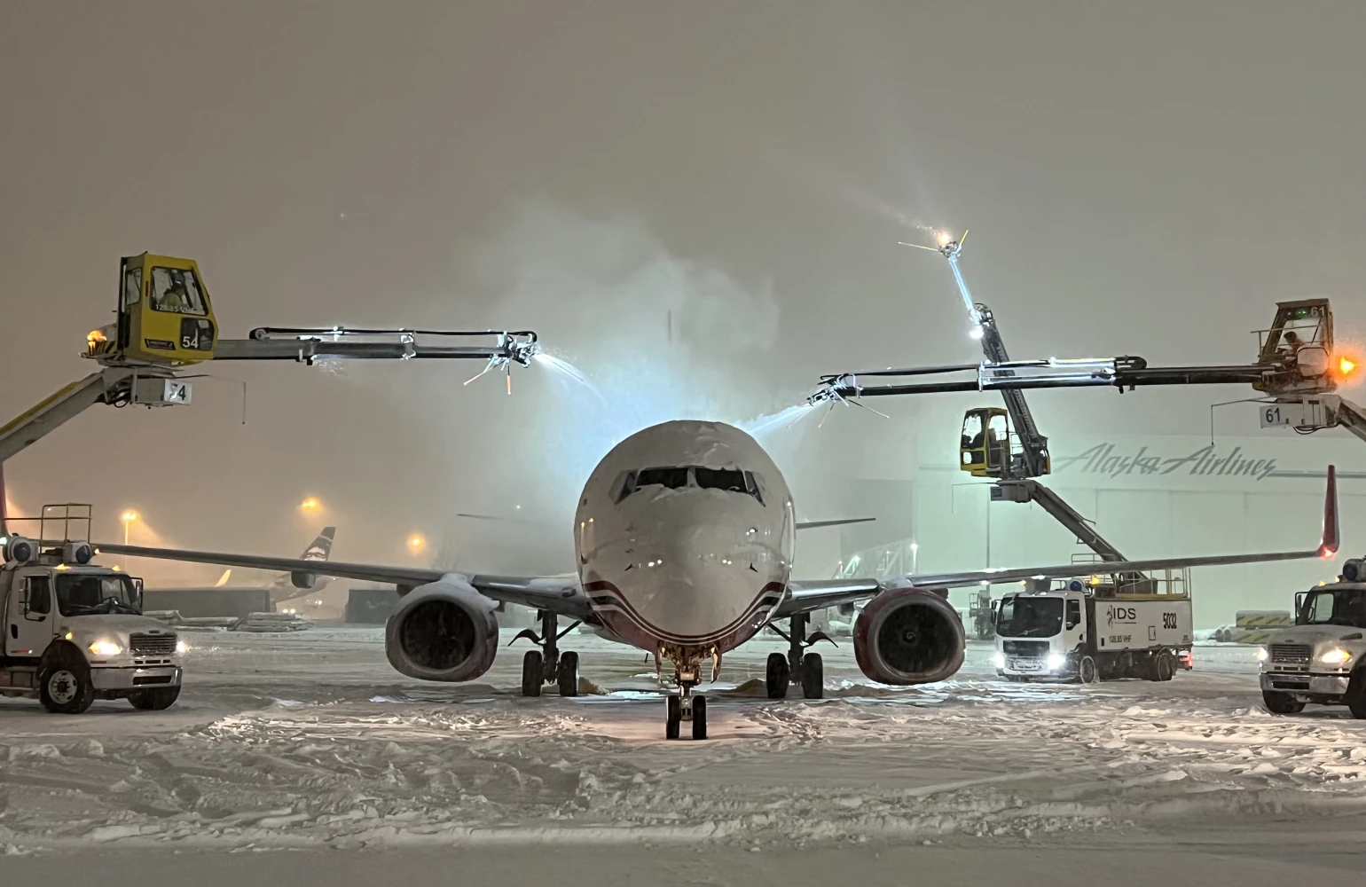 Photo of a NAC airplane being de-iced.